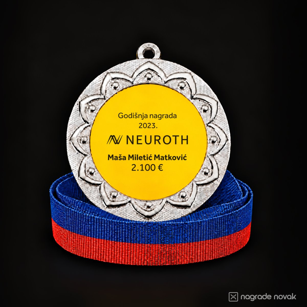 Silver medal with a yellow Neuroth insert, standing on a coiled ribbon in the historic Dinamo colours, blue and red, on a dark background