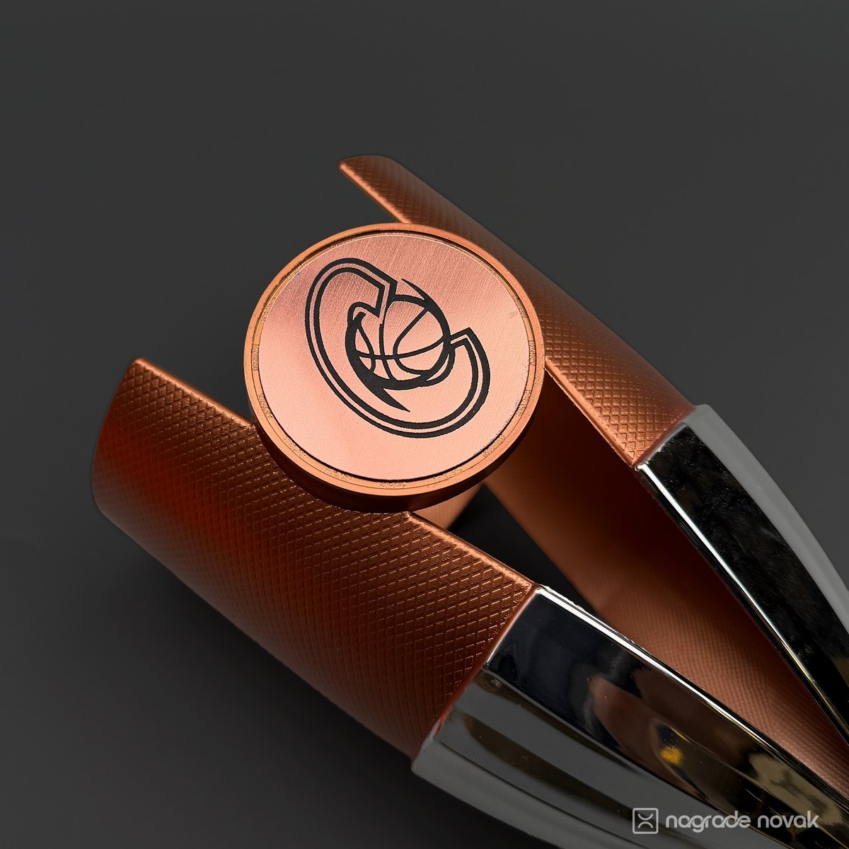 Close-up of a bronze trophy with a copper-coloured insert engraved with the Cedevita logo